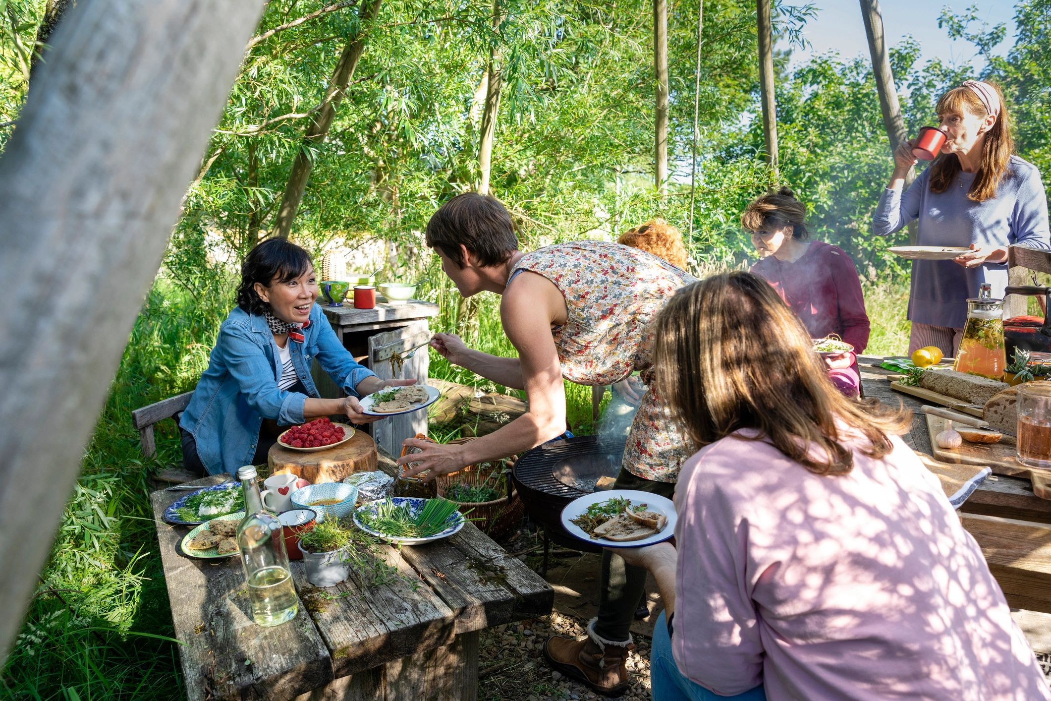 Group enjoying food together outdoors