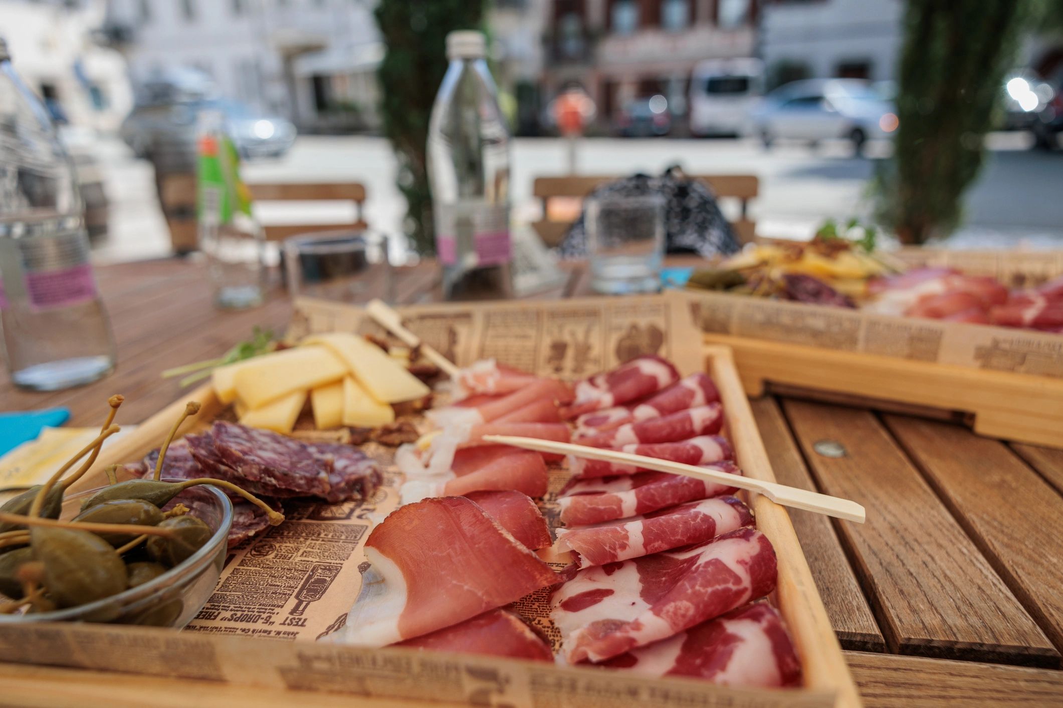 Styled catering table with charcuterie plates and cheese selections