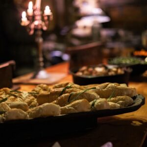 Bread and Food Display at Buffet Table in Candlelight